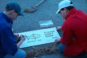 PHOTO - Framingham Scouts Stencil Storm Drains near Sudbury River, Warn People not to Dump Toxic Waste.