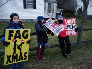 WBC Phelps kids hold up signs.