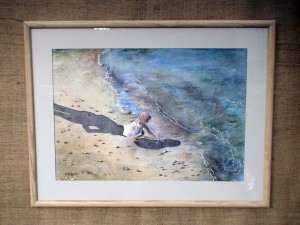 Watercolor by Deborah Bottomley of young girl playing in the surf in the shadow of a watchful parent.