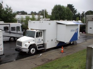 Photo - FEMA and Dept. of Homeland Security mobile command centers meet at the MEMA bunker in Framingham to coordinate emergency efforts for Hurricane Irene (Aug. 2011)