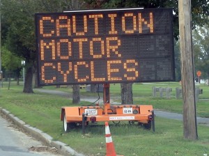 Motor cycle caution sign near road construction in Framingham, MA