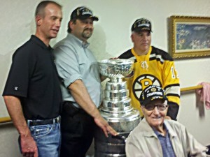 Charlie Jacobs takes time for photo with Bruce Caissie's boss, Bruce, and Uncle Max.