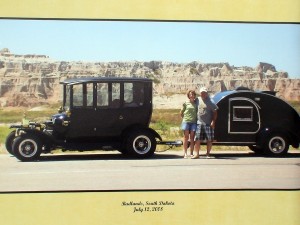 Ribby, his wife, the 1915 Center-Door Model-T and teardrop trailer in the South Dakota Badlands on 2008.