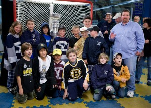 Coach Scott Penrod and his FYHP Squirt ''C2'' Team pose with the Stanley Cup at Loring Arena in Framingham, October 15, 2011.