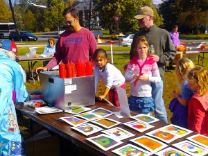 Kids create spin-art at the ''Pies On The Common'' fair at Framingham Centre Common, October 15, 2011.