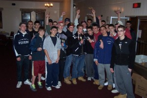 The FHS Flyers Hockey team -- equipped with vegetable peelers, ready to lend a hand to prepare Thanksgiving dinners, (2010 photo).