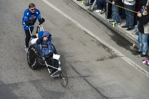 Dick & Rick Hoyt as they pass through Downtown Framingham during the 2013 Boston Marathon.