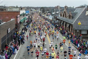 2013 Boston Marathon - runner pass the Train Station in Downtown Framingham